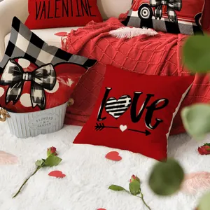 Macro view of Valentine's Day pillow covers featuring LOVE text and heart patterns