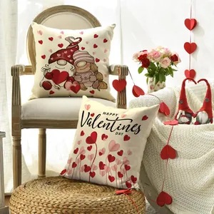 Close-up of Valentine's Day pillow covers with romantic gnomes and heart patterns