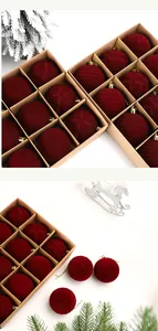 Set of 12 dark red flocked Christmas balls with diverse textures in a kraft box
