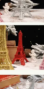 Close-up of glitter-coated Eiffel Tower ornaments in festive holiday scene