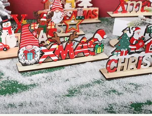 Detailed close-up of wooden Christmas tabletop decorations featuring festive gnomes and Santa Claus