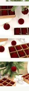 Luxury burgundy flocked Christmas ornaments with textured patterns in a gift box
