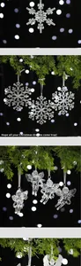 Macro detail of clear acrylic snowflake and angel ornaments for Christmas tree.