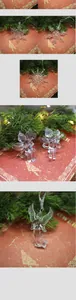 Close-up of transparent acrylic snowflake and angel ornaments on a Christmas tree
