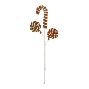 Nahaufnahme der plüschigen rot-grün-weißen Weihnachts-Zuckerstange und Lutscher