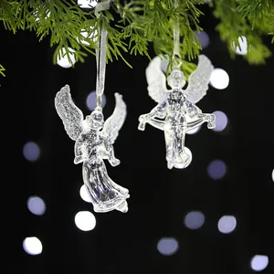 Elegant transparent acrylic angel ornaments hanging on a festive Christmas tree branch