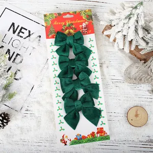 Set of 4 dark green velvet Christmas bows on festive card for DIY tree decoration
