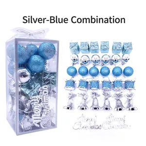 32-piece set of silver and blue Christmas ornaments including balls, bells, and mini drums