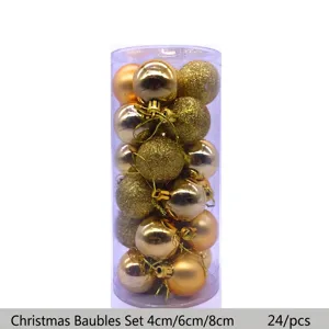 Set of 24 golden Christmas ornament balls with glitter and matte finishes in a tube