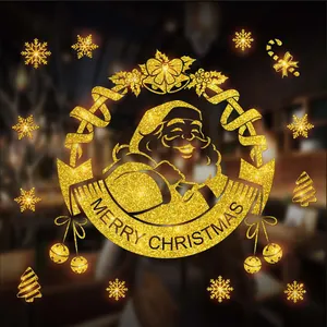 Detailed macro view of gold glitter Santa Claus Christmas window sticker décor