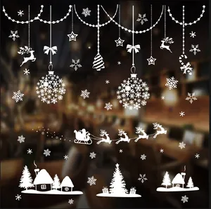 White Christmas window stickers featuring reindeer, snowflakes, and Santa's sleigh.