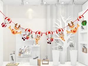 Bannière de Noël festive avec Père Noël et rennes en dessin animé avec parachutes