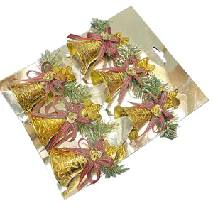 Set of golden plastic Christmas bells with angel figurines and striped bow ornaments