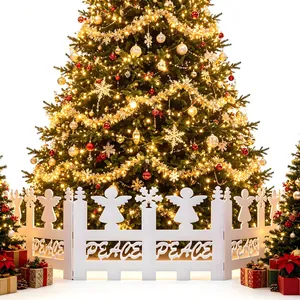 White PVC Christmas tree fence with angel silhouettes and PEACE lettering detail.