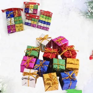 Close-up of colorful mini Christmas gift box ornaments with metallic finish and gold ties.