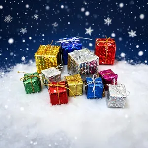 Detailed close-up of colorful mini Christmas gift box ornaments on a snowy background