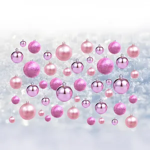 Detailed view of 26 assorted pink Christmas baubles with shiny, matte, and glitter finishes