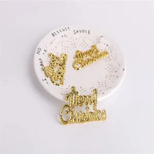 Detailed macro view of golden plastic Merry Christmas letter plate decorations for trees