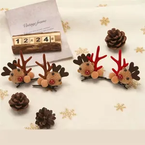 Detailed view of cute plush reindeer antler hair clips with Christmas props