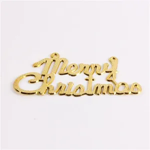 Detail view of golden Merry Christmas decorative letter sign for Christmas tree