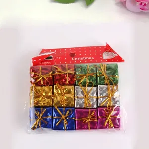 Set of mini Christmas gift box ornaments in colorful foil for tree decoration.