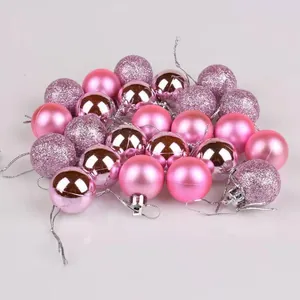 Set of pink Christmas baubles with shiny, matte, and glittery finishes for tree decor