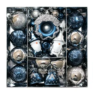 Close-up of navy blue and silver 60pcs Christmas ornament set featuring gnomes and donuts