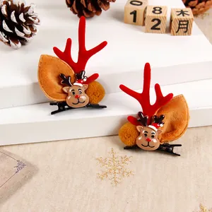 Close-up of cute 3D reindeer antler hair clips with festive Christmas ornaments