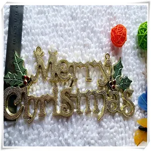 Golden plastic 'Merry Christmas' sign decoration for festive holiday tree or gift box