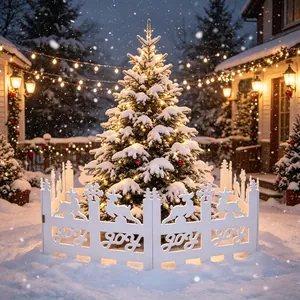 Outdoor Christmas scene featuring a white PVC fence with Joy and reindeer cutouts.