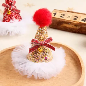 Glittery Christmas mini hat hair clip with red pom-pom and white tulle base