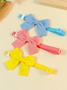 Close-up detail of adjustable waffle texture pet bow ties in blue, pink, and yellow