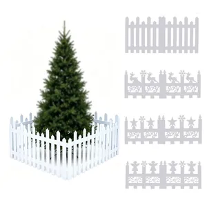 Decorative white PVC picket fence for Christmas tree base with Joy and Peace festive cutouts.
