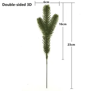 Detailed view of artificial pine branch with 6cm width and 23cm length specifications