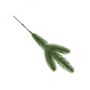 Macro detail of a three-pronged artificial green pine needle branch for DIY decor