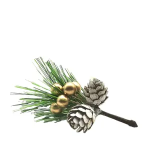 Artificial Christmas pine needle branch with white pinecones and gold berries on white