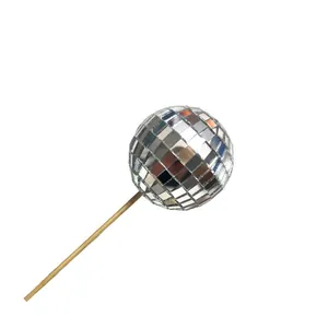 Sparkling glass mirror disco ball cake topper on a wooden stick for birthday party decor