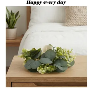 Detail of eucalyptus leaves wreath candle holder on a modern wooden nightstand