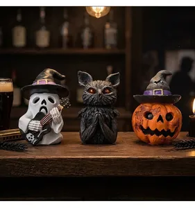 Set of vintage Halloween resin figurines featuring a ghost, owl, and pumpkin decor.