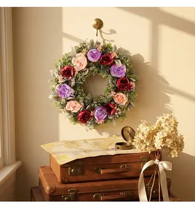Detailed view of a colorful peony floral wreath hanging in a vintage indoor room setting