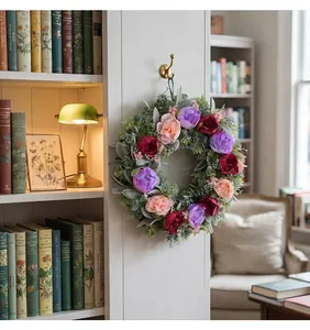 Detailed view of a colorful peony wreath hanging in a vintage home library setting