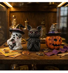 Detailed view of vintage Halloween resin ornaments featuring ghost, owl, and pumpkin