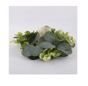 Detailed view of artificial eucalyptus leaf candle ring for table decoration