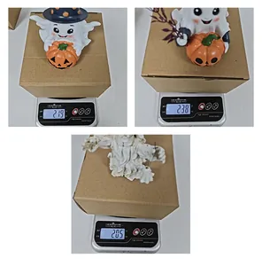 Detailed weight measurement showing the mass of various Halloween ghost and pumpkin resin ornaments