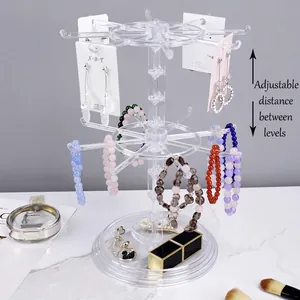 Rotating acrylic jewelry display stand with adjustable height tiers for earrings