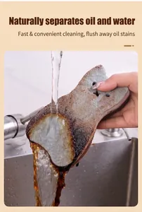 Detailed view of cat-shaped dish sponge rinsing off oil stains under water