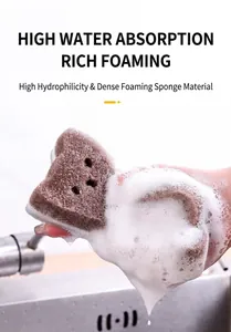 Macro detail of cat-shaped three-layer sponge generating rich white foam for cleaning.