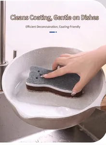 Action shot showing the cat-shaped 3-layer dish sponge cleaning a pan in a kitchen sink