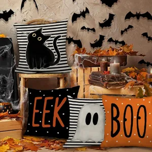 Detailansicht der Halloween Kissenbezüge mit Gespenster-, Katzen- und Textmustern.