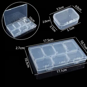 Vue détaillée d'une boîte de rangement en plastique transparent avec dimensions et casiers.